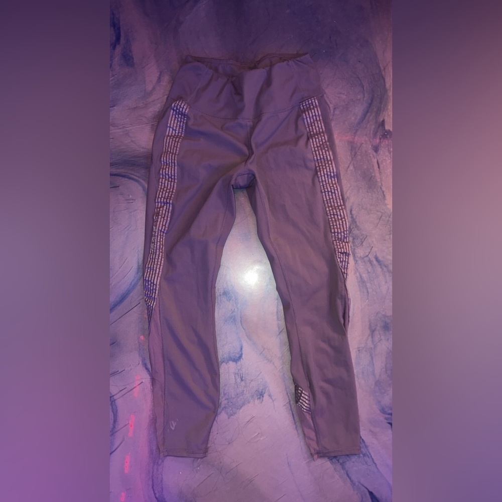 lavender Active life leggings with designs on the side.